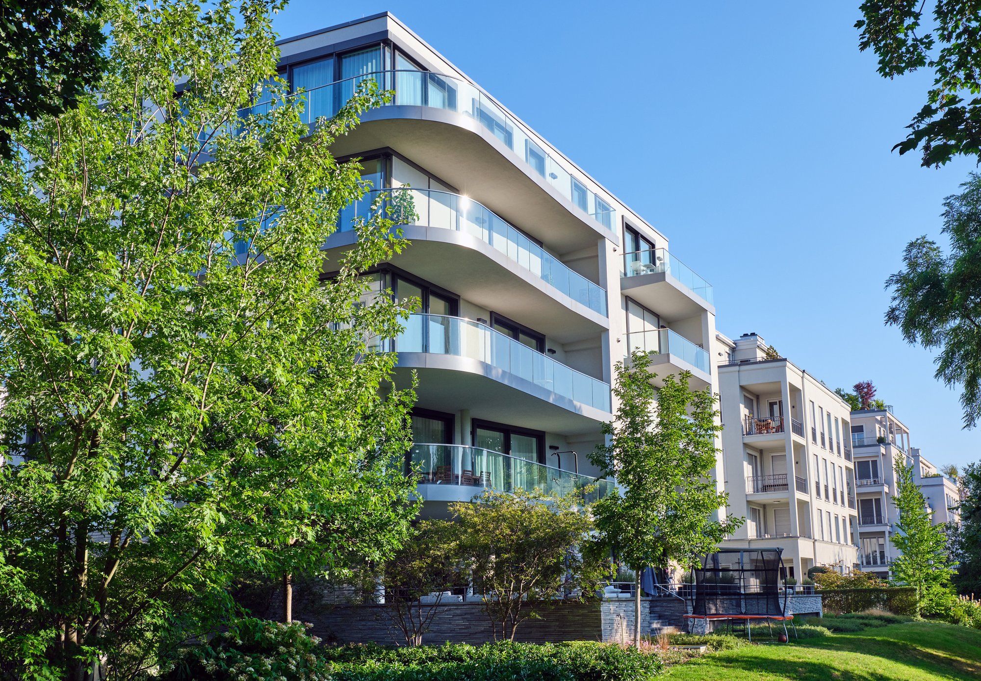 residential building with trees from street